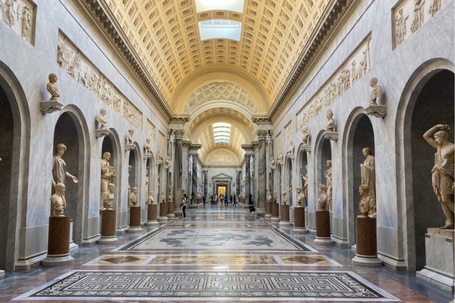 corridor in the vatican museum with sculptures